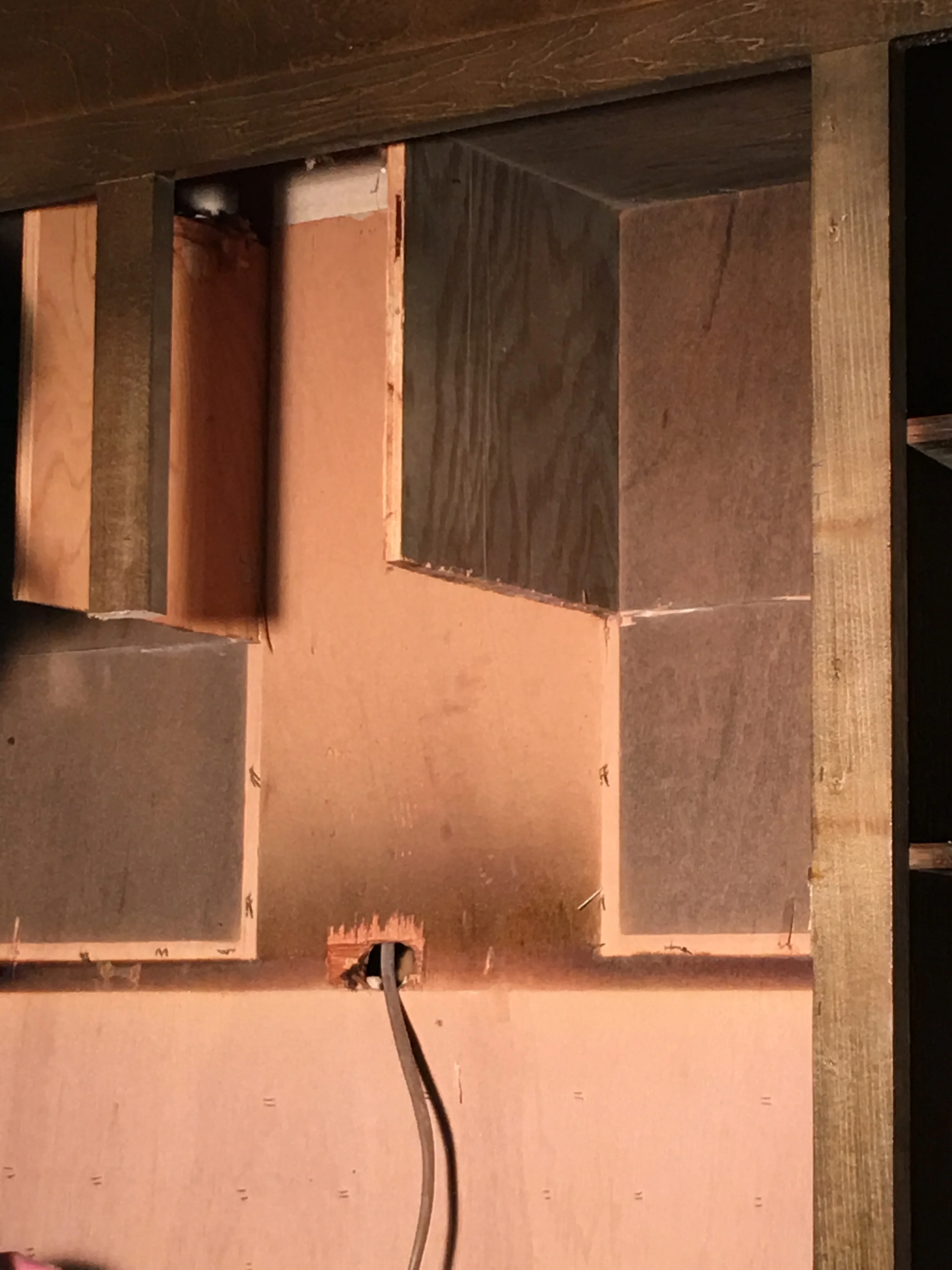 Drywall panels installed on wooden frame studs during interior remodeling project